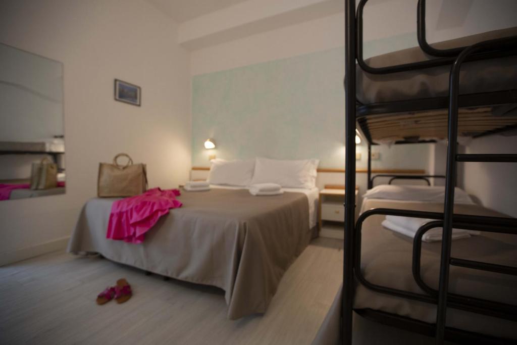 Postel nebo postele na pokoji v ubytování Hotel Eden B&B