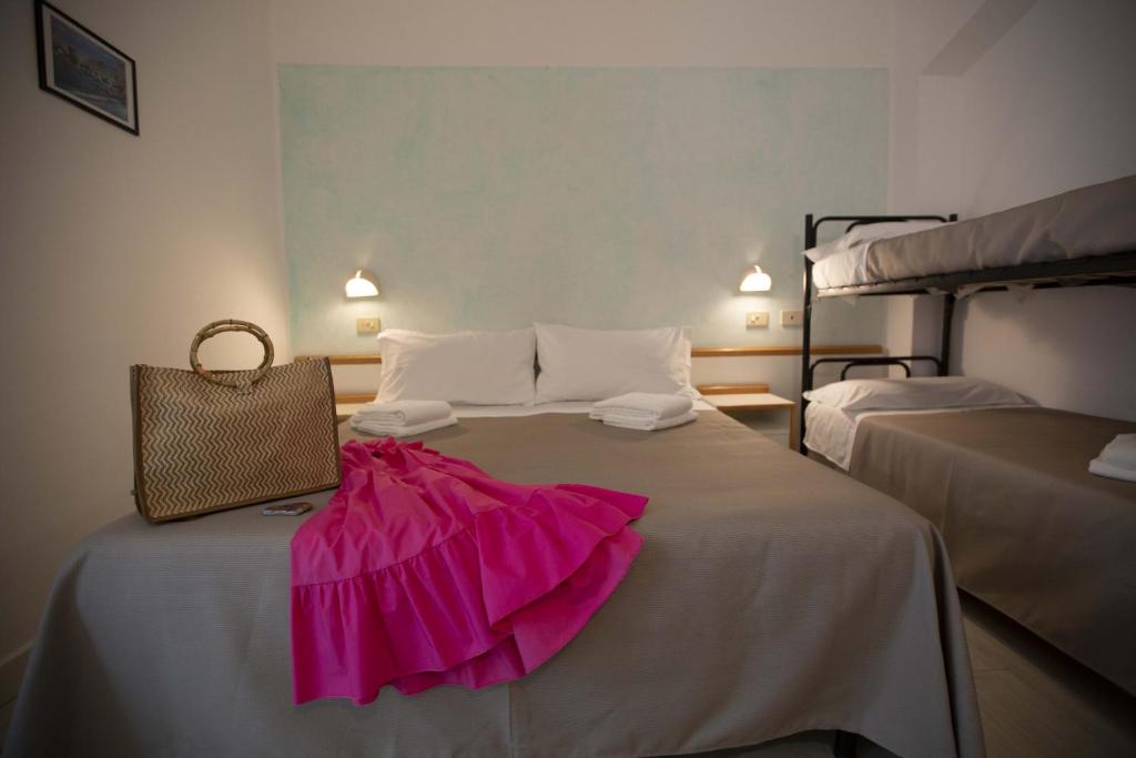 Postel nebo postele na pokoji v ubytování Hotel Eden B&B