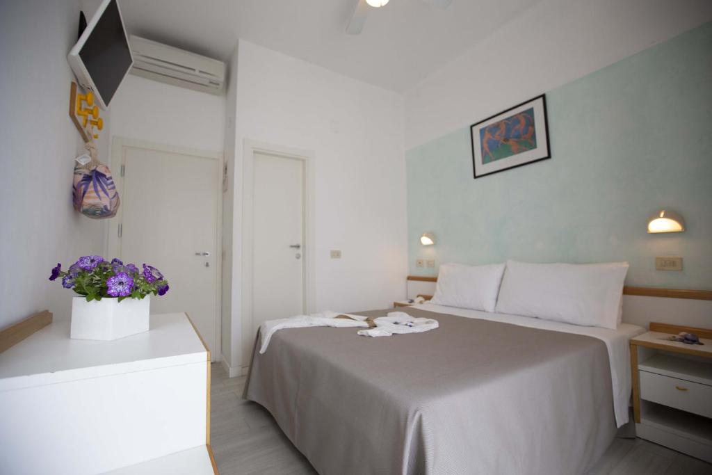 Postel nebo postele na pokoji v ubytování Hotel Eden B&B