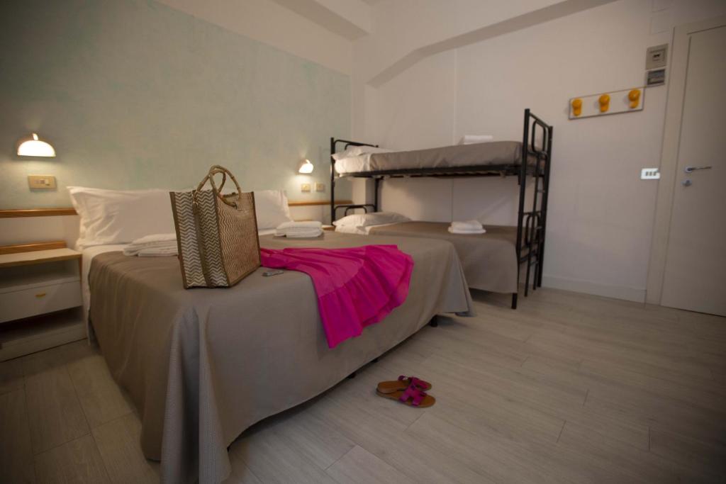 Postel nebo postele na pokoji v ubytování Hotel Eden B&B