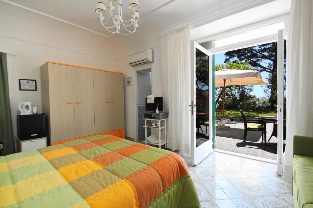 Postel nebo postele na pokoji v ubytování Casa Augusto B&B