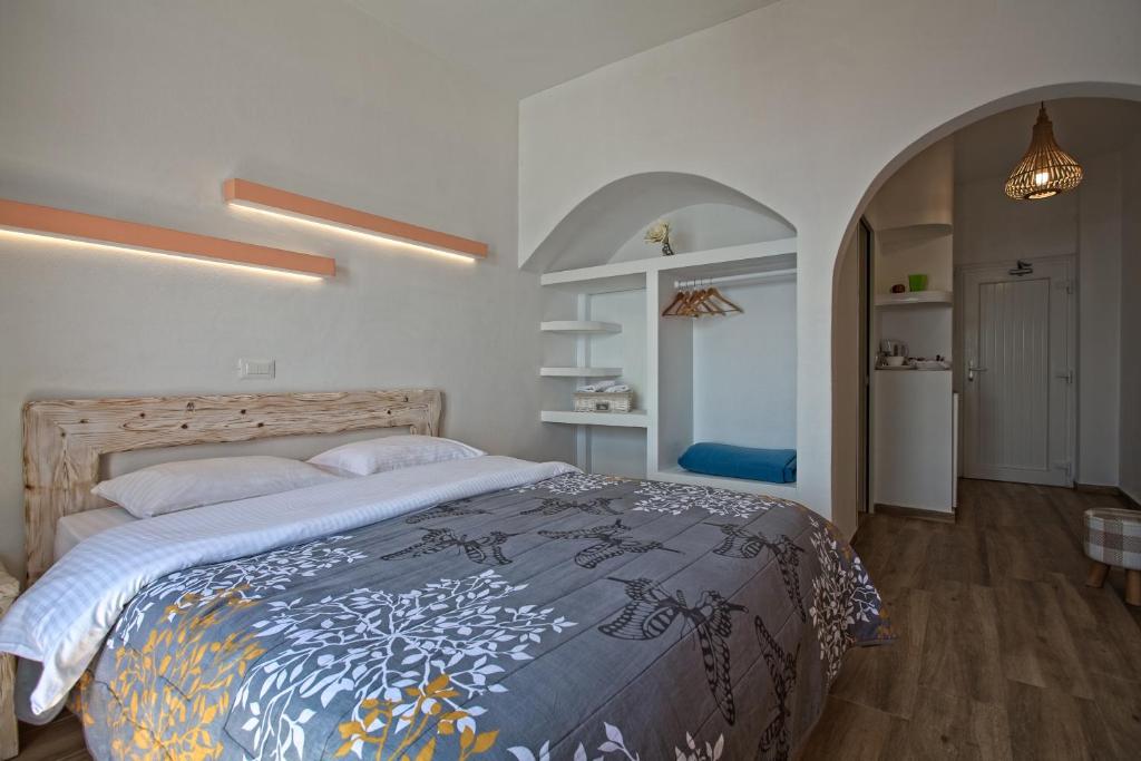 A bed or beds in a room at Caldera Butterfly Villas