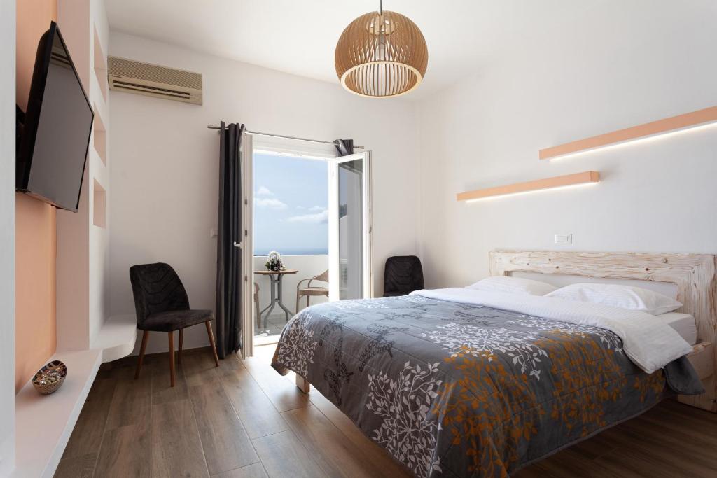 A bed or beds in a room at Caldera Butterfly Villas