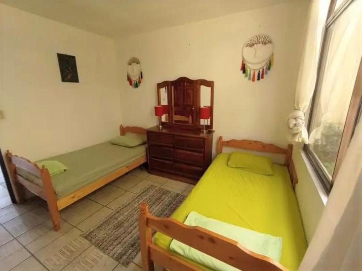 Postel nebo postele na pokoji v ubytování Nirvana Apartament Hostal