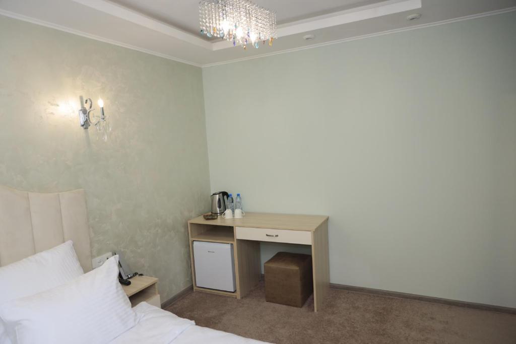 Postel nebo postele na pokoji v ubytování DeLin Hotel And Tours