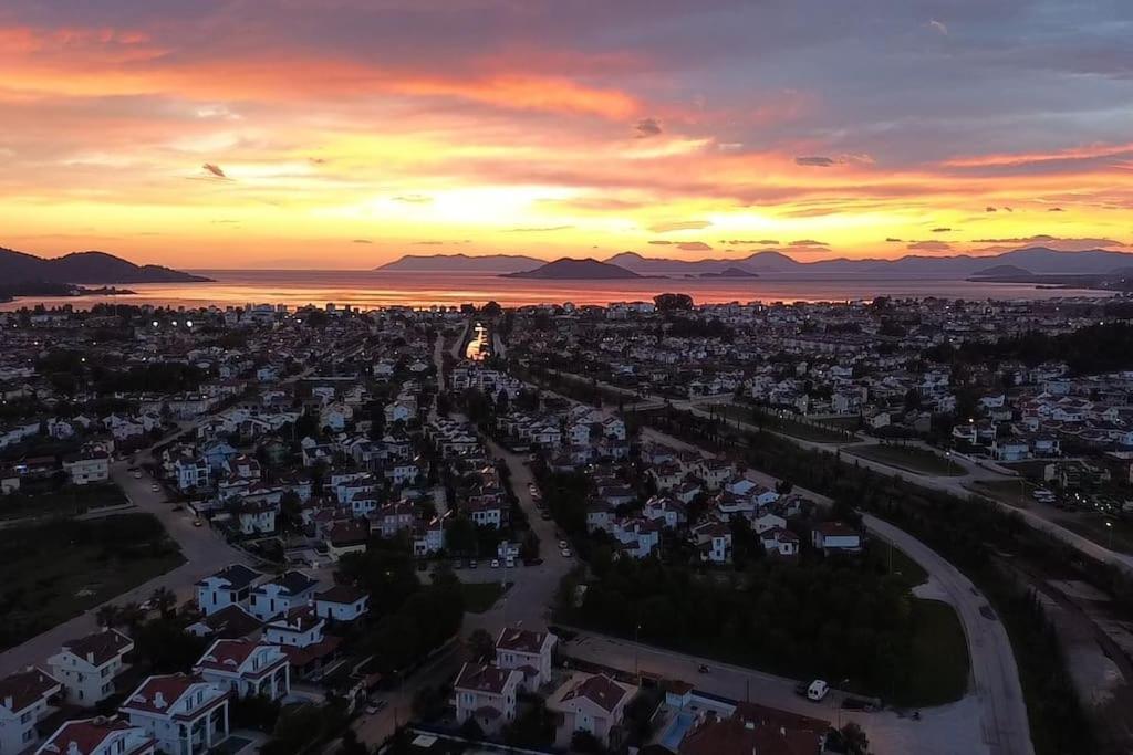 an aerial view of a city at sunset at Sunshine Guest house with terrace in Fethiye