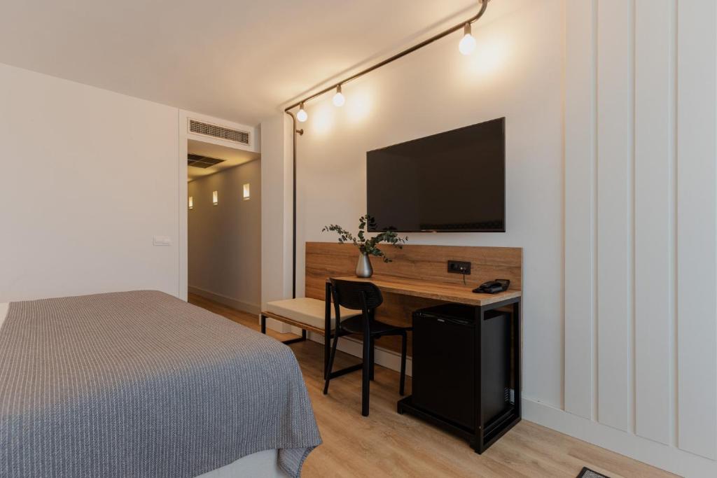 TV a/nebo společenská místnost v ubytování Magnolia Hotel - Adults Only