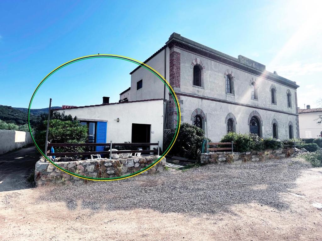 a large building with a large hoop in front of it at Eroico sul Mare in Portoferraio