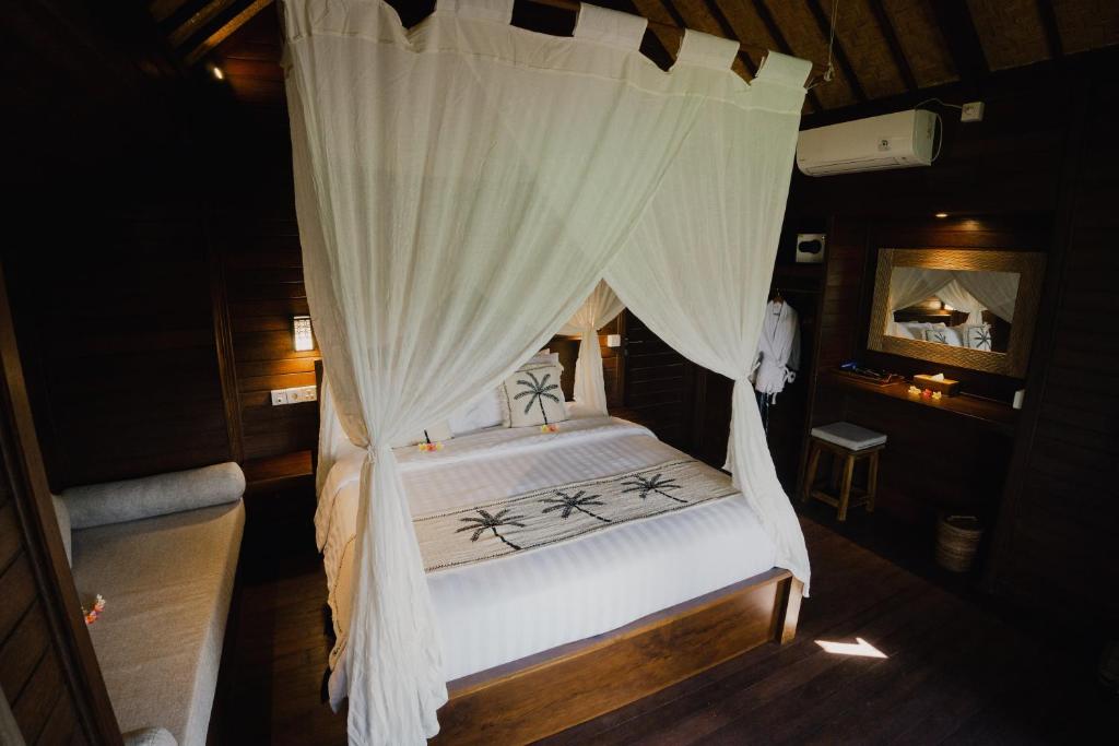 Postel nebo postele na pokoji v ubytování Sunset Star Huts