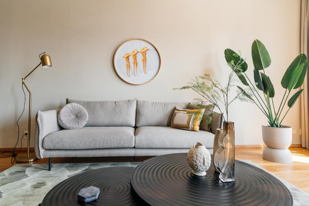 a living room with a couch and a table at BizStay Harbour IV in Scheveningen