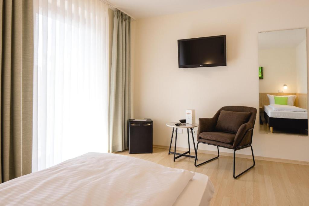 TV a/nebo společenská místnost v ubytování AKZENT Hotel Meerfräulein
