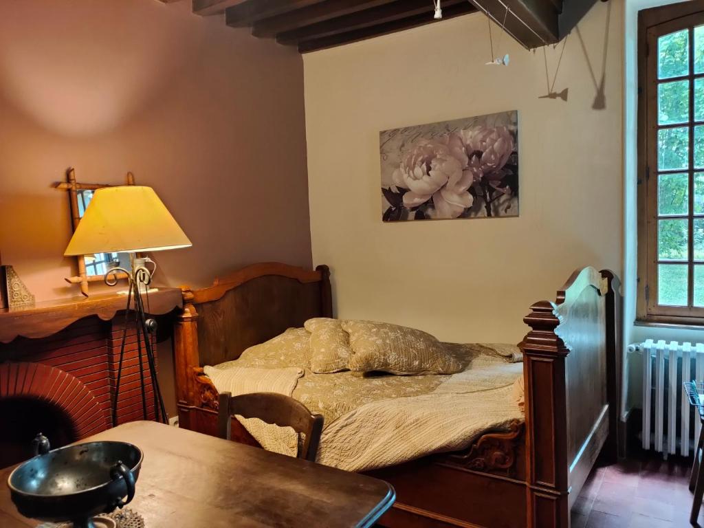 Postel nebo postele na pokoji v ubytování La ferme des douceurs