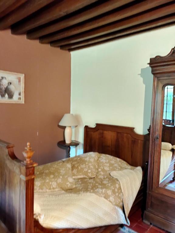 Postel nebo postele na pokoji v ubytování La ferme des douceurs