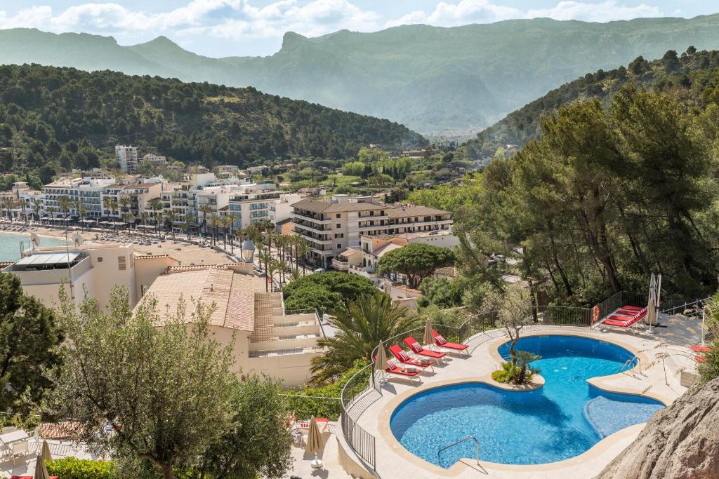 a resort with a swimming pool and a beach at Pure Salt Port de Sóller in Port de Soller