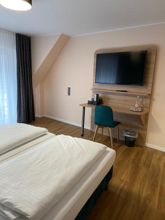 Postel nebo postele na pokoji v ubytování Art Hotel Eifel
