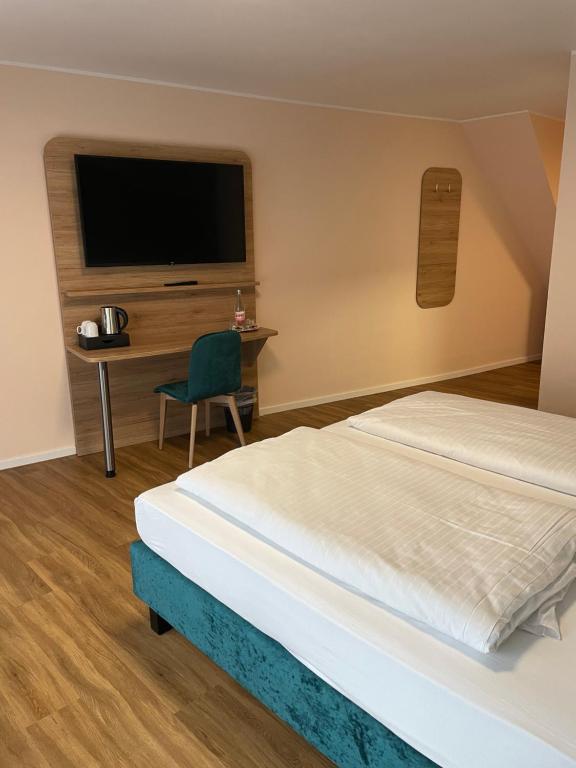 Postel nebo postele na pokoji v ubytování Art Hotel Eifel