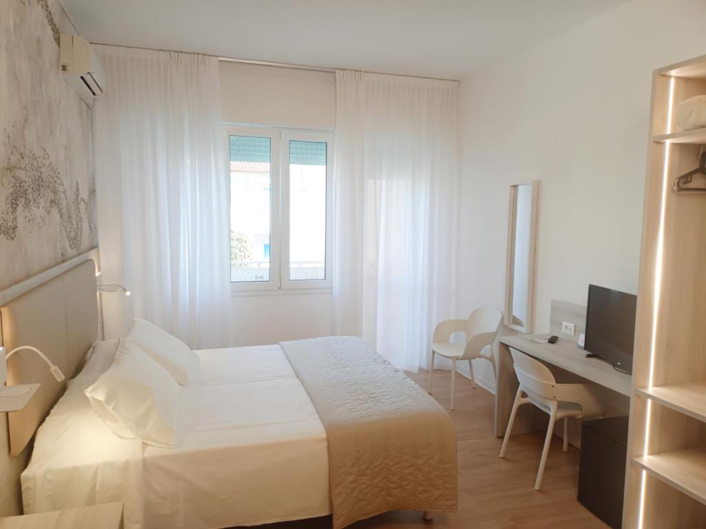 Postel nebo postele na pokoji v ubytování Hotel Splendid