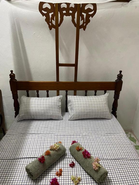 Postel nebo postele na pokoji v ubytování Sanaa Hostel
