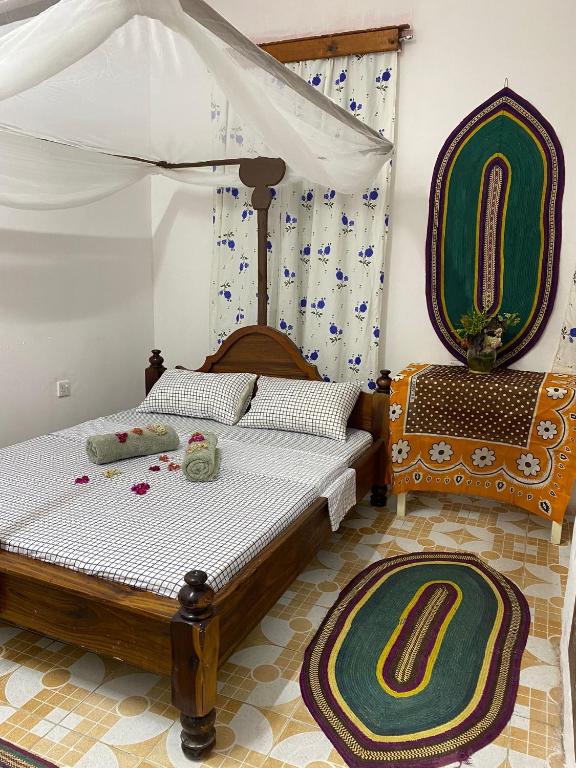 Postel nebo postele na pokoji v ubytování Sanaa Hostel