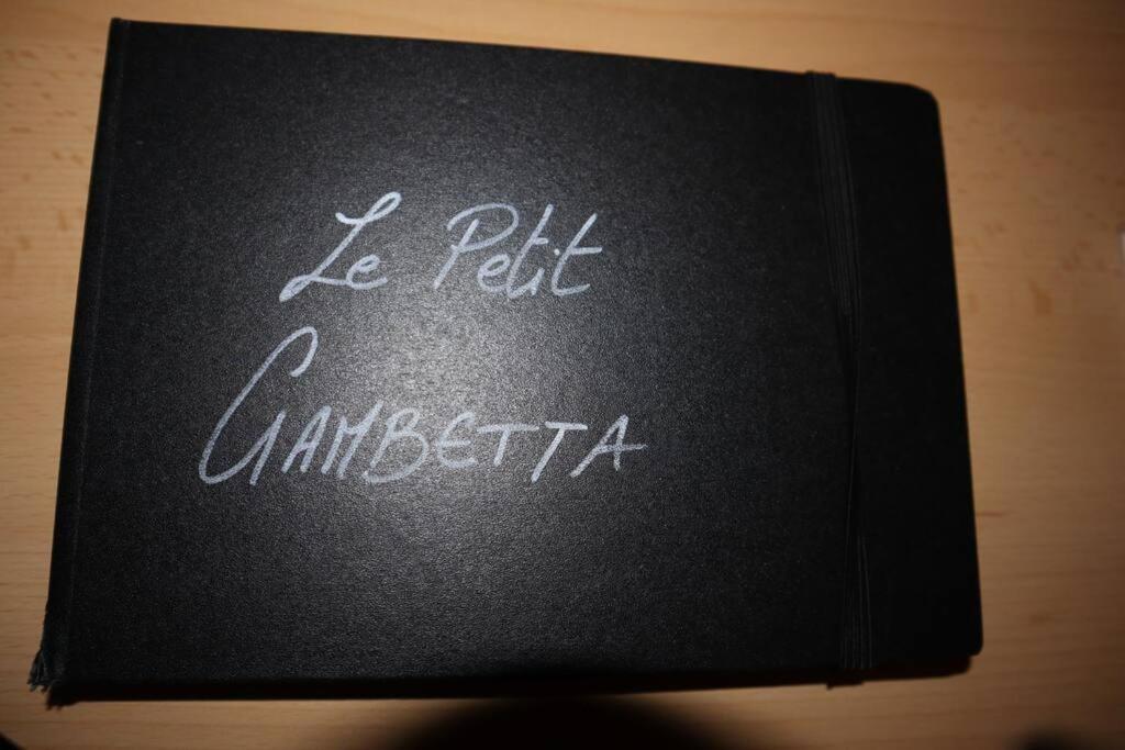 a black book with the words be felt cantina at Le petit Gambetta in Belfort
