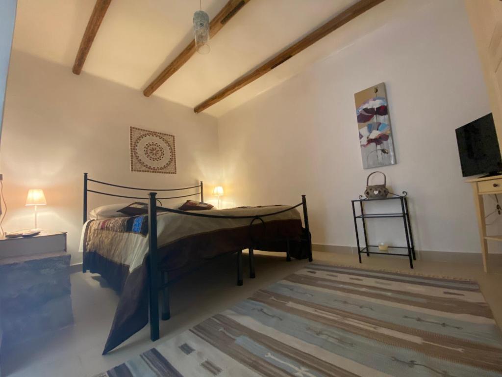 Postel nebo postele na pokoji v ubytování Donna Maria