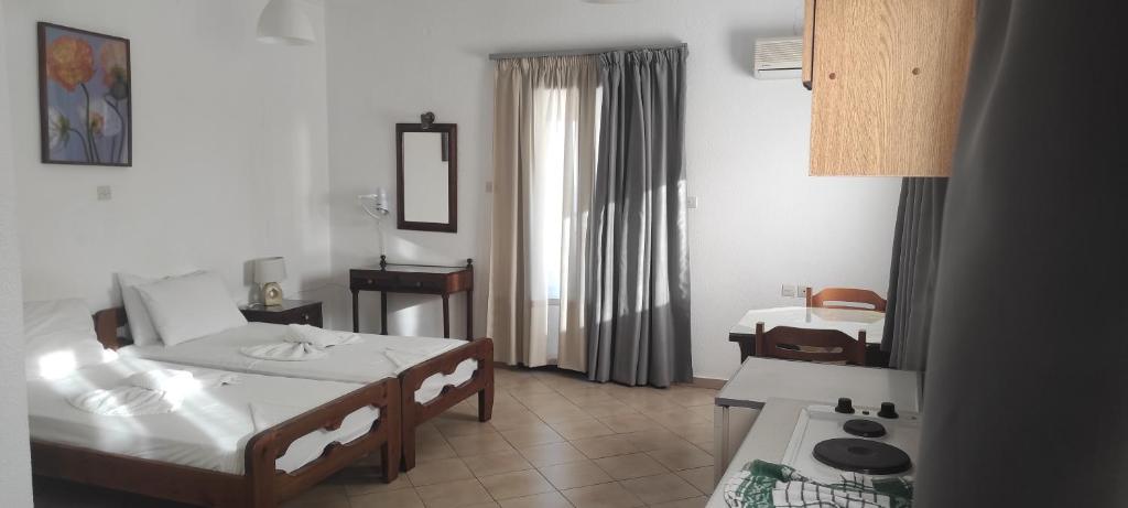 Postel nebo postele na pokoji v ubytování Smaragda Hotel