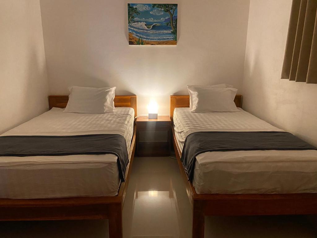 Postel nebo postele na pokoji v ubytování Balian Hideaway