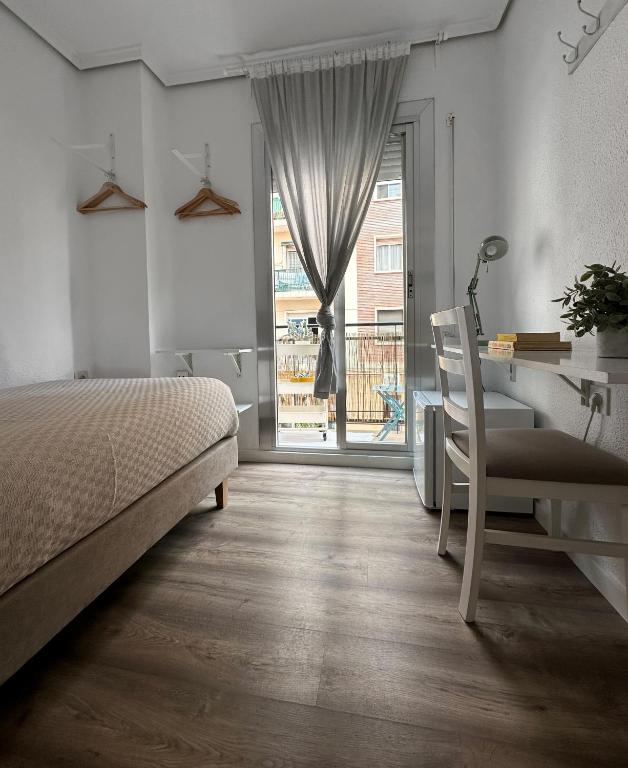 Postel nebo postele na pokoji v ubytování Slow Room Valencia