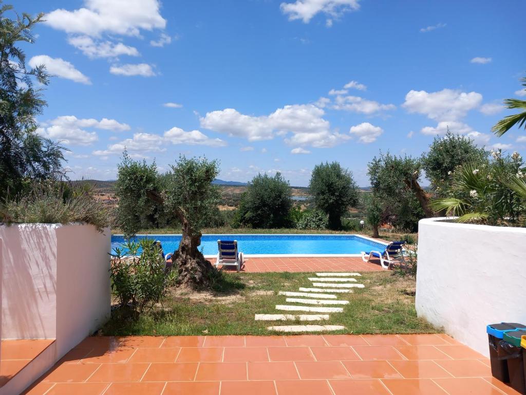 a view of a swimming pool in a backyard at Casa De Terena in Terena