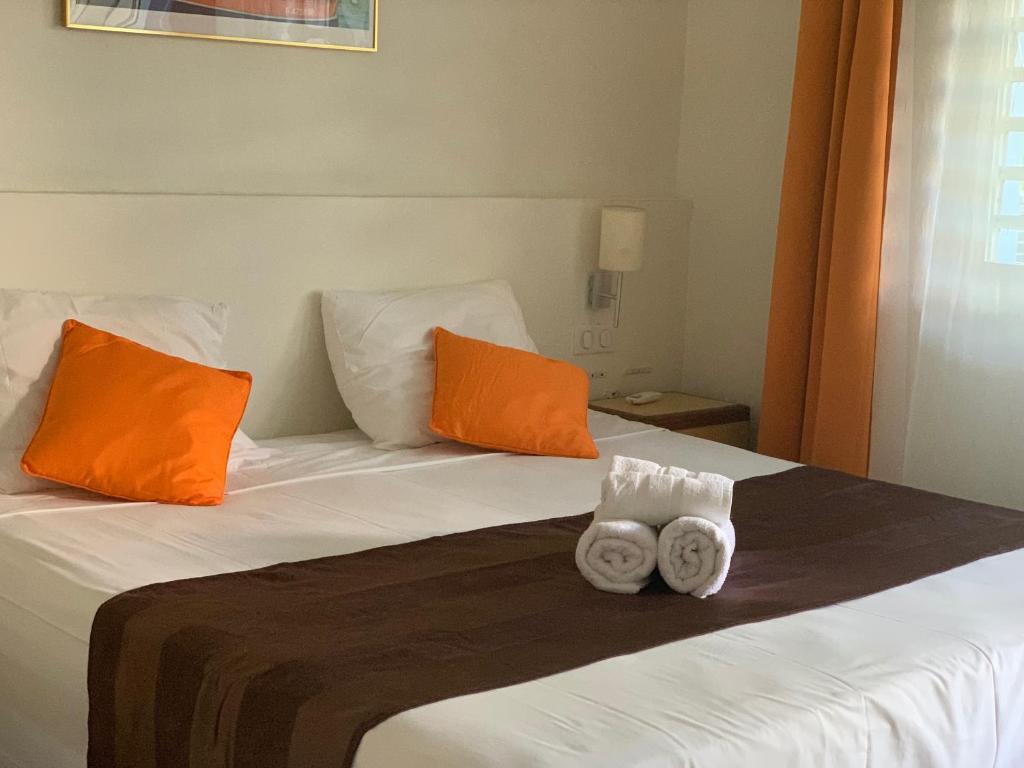 Postel nebo postele na pokoji v ubytování Hôtel DOUCE VAGUE