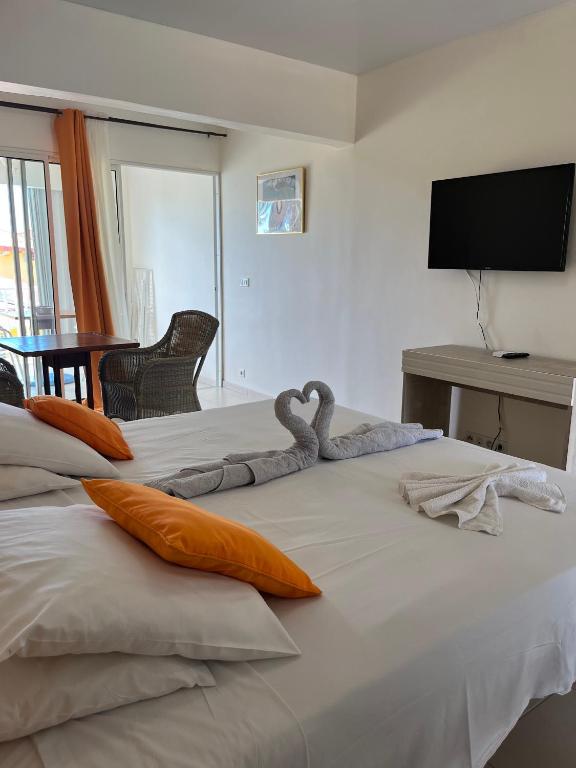 Postel nebo postele na pokoji v ubytování Hôtel DOUCE VAGUE
