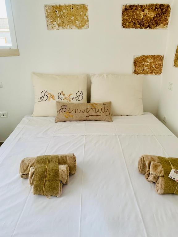 Letto o letti in una camera di Nonna Veronica
