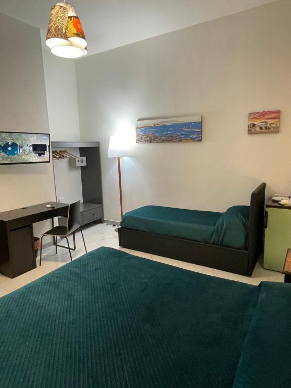 Posteľ alebo postele v izbe v ubytovaní Dante Rooms