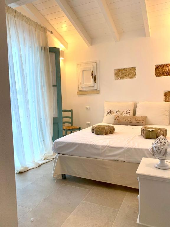 Letto o letti in una camera di Nonna Veronica