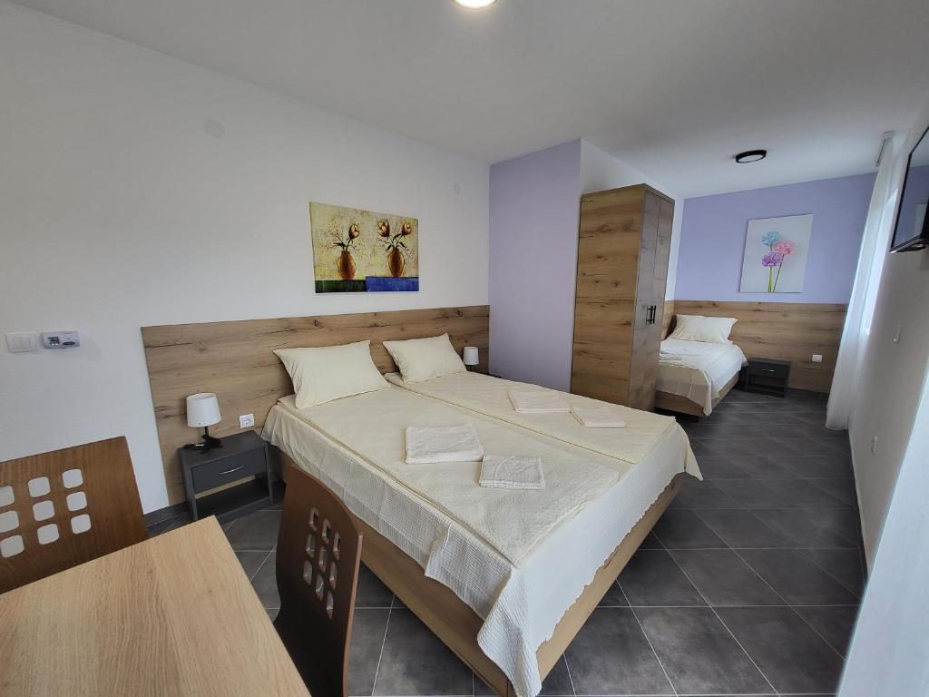 Postel nebo postele na pokoji v ubytování Vila Pčelica Petra
