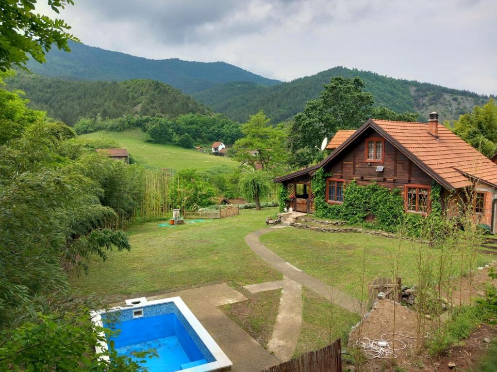 a house with a swimming pool in the yard at Brvnara Aleksic in Kraljevo