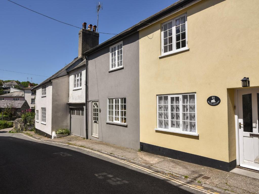 a row of houses on the side of a street at 21 Mill Green in Lyme Regis