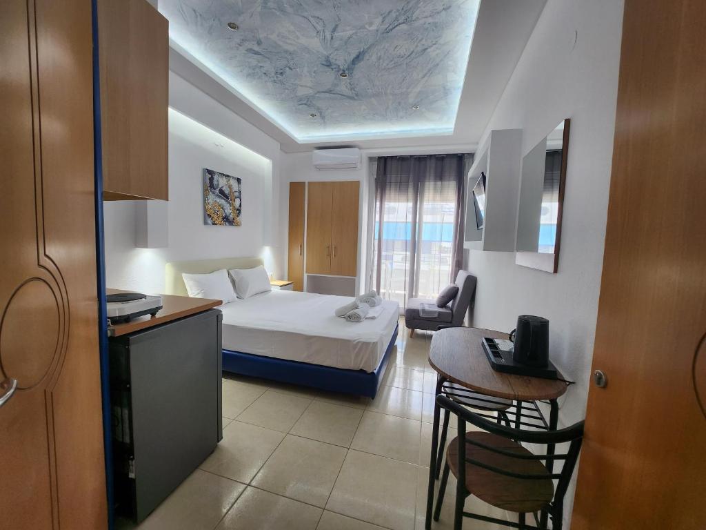 Postel nebo postele na pokoji v ubytování The Blue Beach Apartments