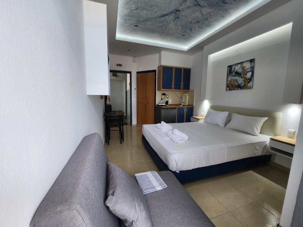Postel nebo postele na pokoji v ubytování The Blue Beach Apartments