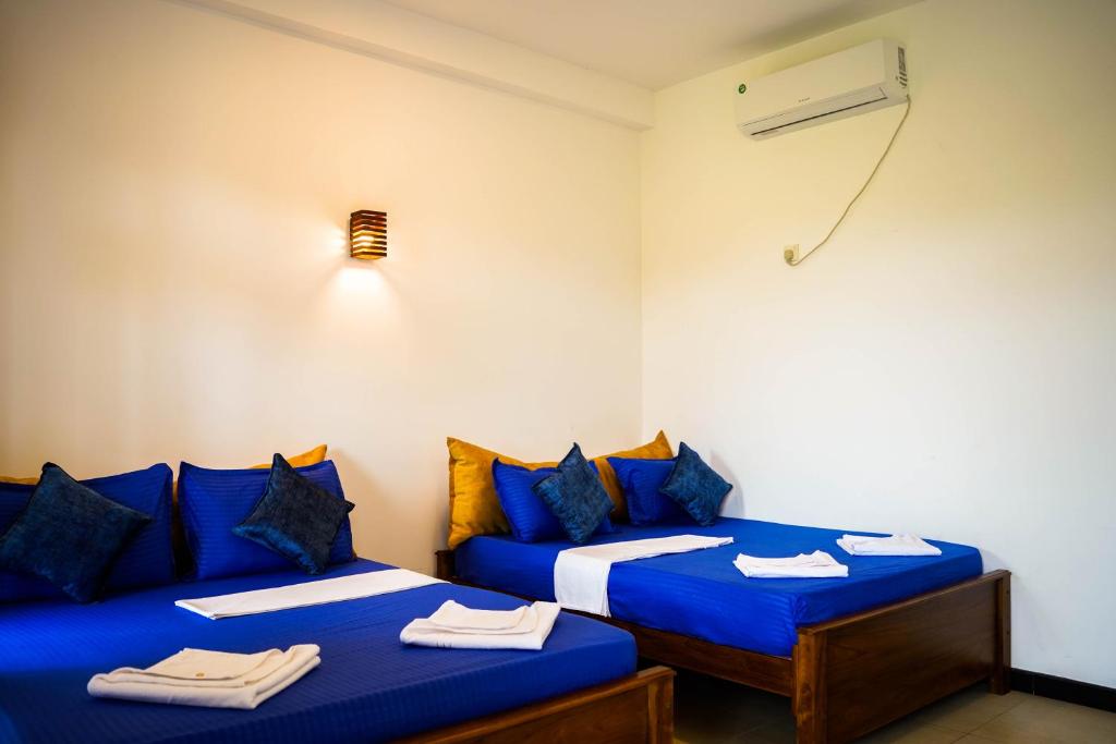 Postel nebo postele na pokoji v ubytování Sigiri Sierra View Resort