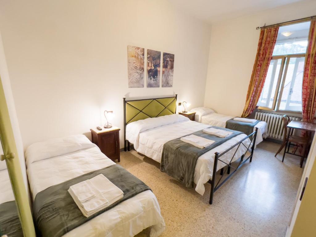 Postel nebo postele na pokoji v ubytování Monte Marsicano Hotel