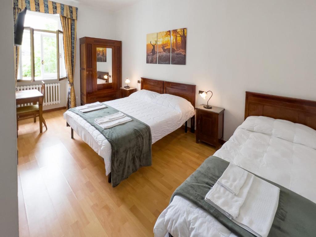Postel nebo postele na pokoji v ubytování Monte Marsicano Hotel