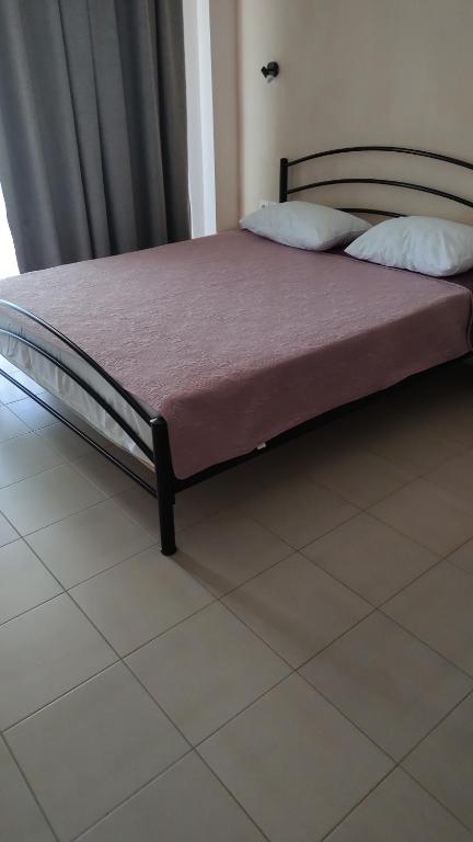 Postel nebo postele na pokoji v ubytování Persefoni Rooms Apartments & Mezonetes