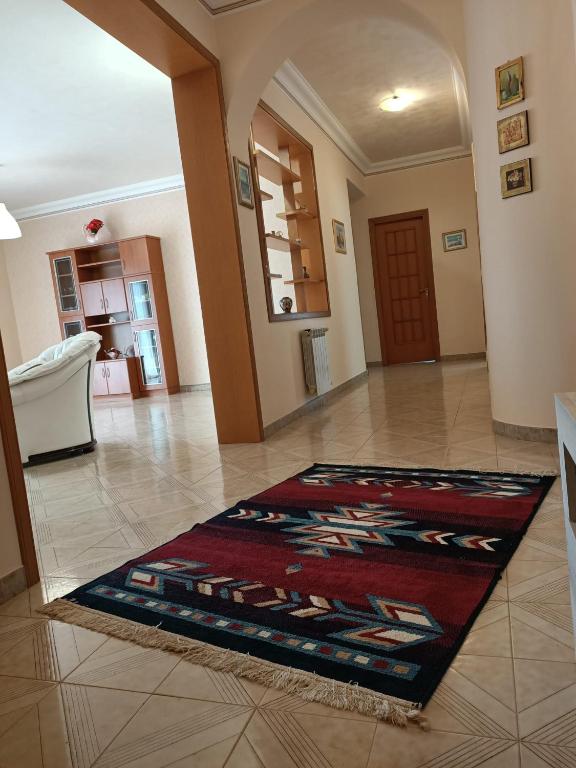 a living room with a rug on the floor at La Perla dei Templi in Agrigento