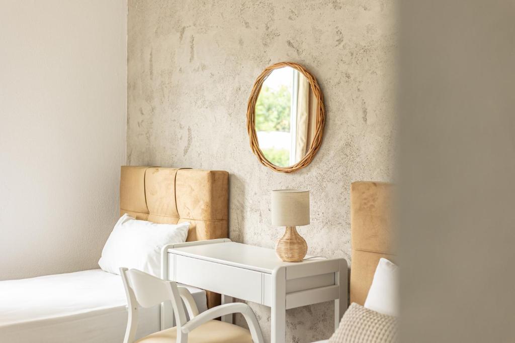 Postel nebo postele na pokoji v ubytování Theo Bungalows Boutique Hotel