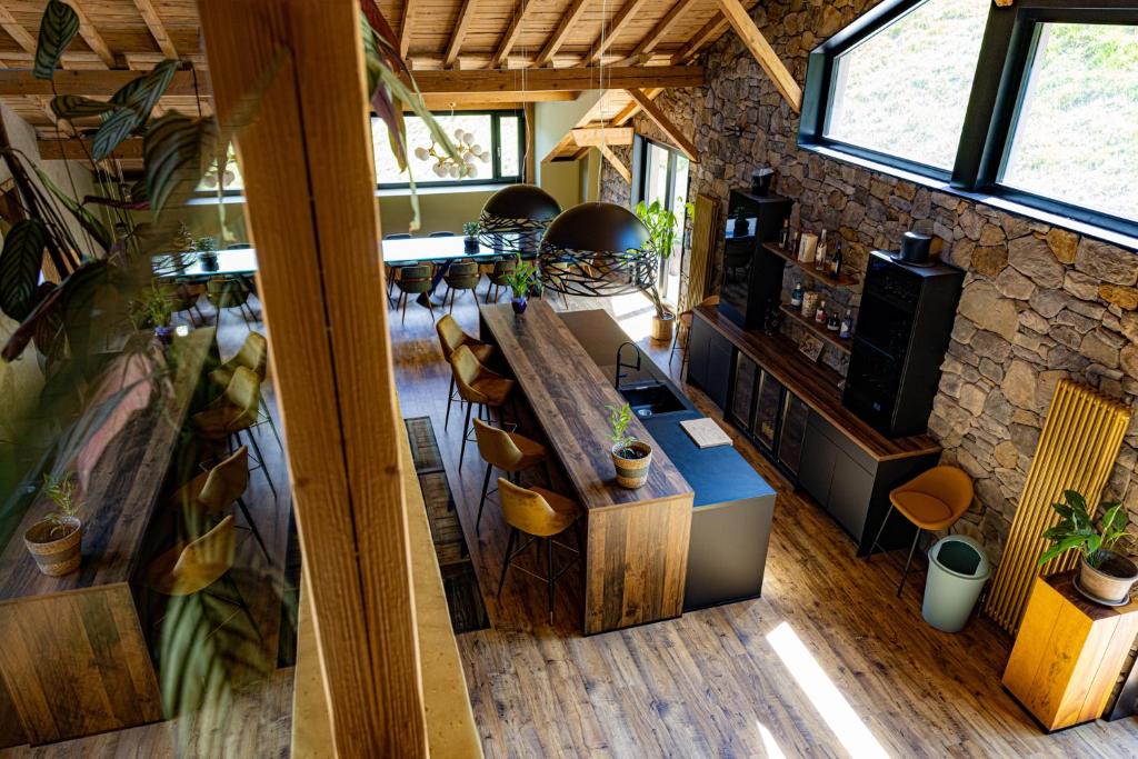 an overhead view of a room with a stone wall at Le 11 des Bouchaux, Gîte d&#39;exception in La Bresse