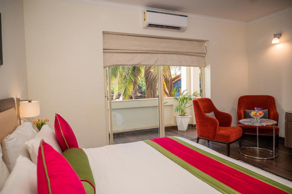 Postel nebo postele na pokoji v ubytování La Oasis by Meraden ,Goa