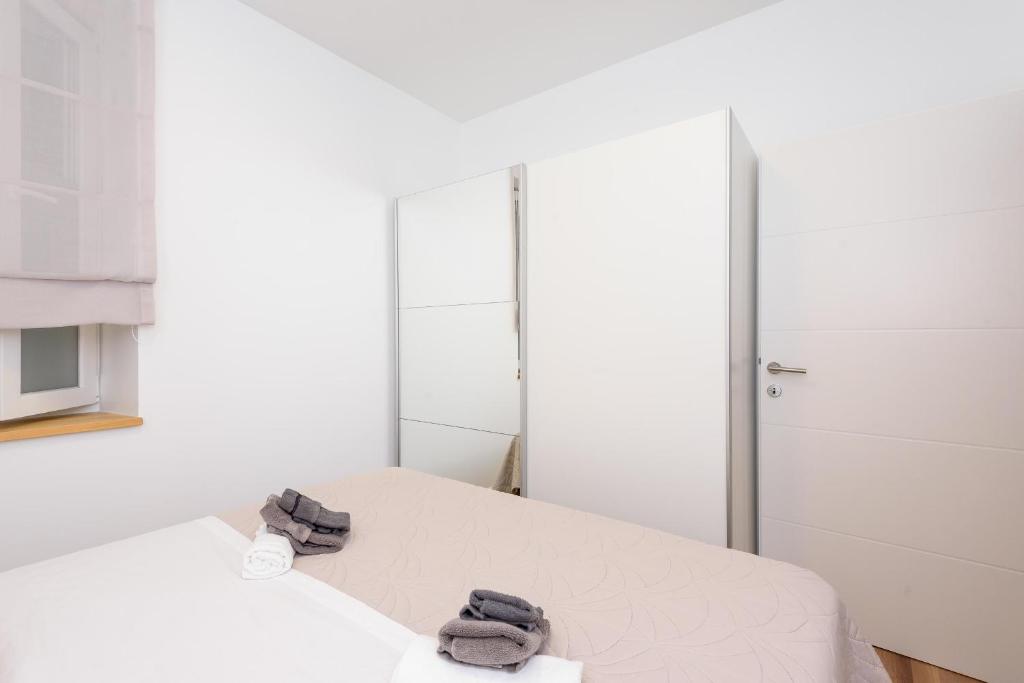 Postel nebo postele na pokoji v ubytování Apartmani Boras
