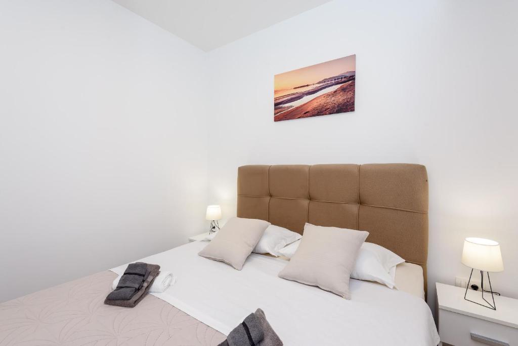 Postel nebo postele na pokoji v ubytování Apartmani Boras