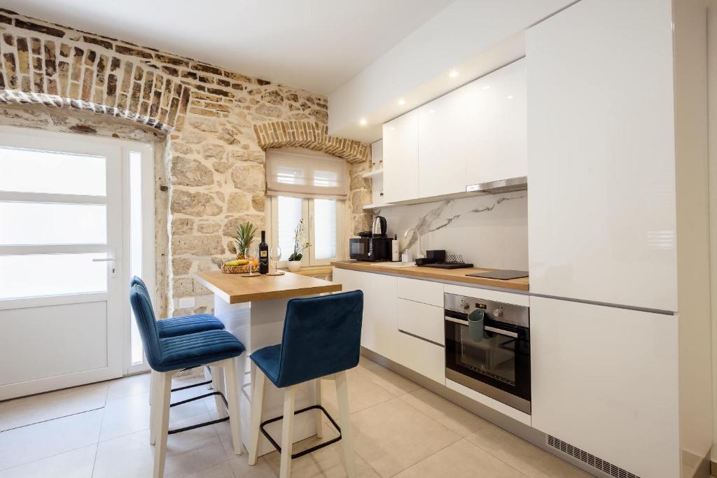 Kuchyň nebo kuchyňský kout v ubytování Apartmani Boras
